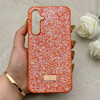 قاب گوشی Galaxy S23 FE سامسونگ نگین دار سواروسکی SWAROVSKI پلاک فلزی نارنجی کد 153036