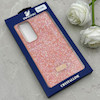 قاب گوشی Galaxy S24 FE سامسونگ نگین دار سواروسکی SWAROVSKI پلاک فلزی نارنجی کد 153045