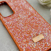 قاب گوشی Galaxy S24 FE سامسونگ نگین دار سواروسکی SWAROVSKI پلاک فلزی نارنجی کد 153045
