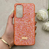 قاب گوشی Galaxy S24 FE سامسونگ نگین دار سواروسکی SWAROVSKI پلاک فلزی نارنجی کد 153045