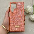 قاب گوشی Galaxy S23 Ultra سامسونگ نگین دار سواروسکی SWAROVSKI پلاک فلزی نارنجی کد 153055