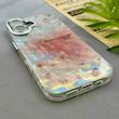قاب گوشی iPhone 17 آیفون فانتزی براق IMD لیزری لاکچری سخت HARD طرح گل زیبا کد 154539
