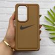 قاب گوشی Galaxy S24 Ultra سامسونگ سیلیکونی طرح نایکی NIKE پافر PC زیر بسته محافظ لنز دار کد 155020