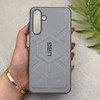 قاب گوشی Galaxy A16 سامسونگ UAG Design سیلیکونی ژله ای محافظ لنز دار طوسی کد 163037