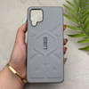 قاب گوشی Galaxy A12 - M12 سامسونگ UAG Design سیلیکونی ژله ای محافظ لنز دار طوسی کد 163048