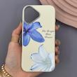 قاب گوشی iPhone 16 آیفون لدر کیس سیلیکونی فانتزی لنز سیلور طرح گل لیلیوم آبی کد 169248