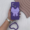 قاب گوشی Galaxy A21S سامسونگ سیلیکونی بنفش پاپیون‌دار با بند قلبی و محافظ لنز
