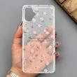 قاب گوشی Galaxy A06 سامسونگ شفاف پشت طلقی شیشه‌ای دور ژله ای طرح گل صورتی