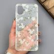 قاب گوشی Galaxy A07 سامسونگ شفاف پشت طلقی شیشه‌ای دور ژله ای طرح گل سفید