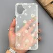 قاب گوشی Galaxy A07 سامسونگ شفاف پشت طلقی شیشه‌ای دور ژله ای طرح گل بابونه