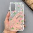 قاب گوشی Galaxy A15 سامسونگ شفاف پشت طلقی شیشه‌ای دور ژله ای طرح گل لاله