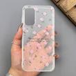 قاب گوشی Galaxy A15 سامسونگ شفاف پشت طلقی شیشه‌ای دور ژله ای طرح گل صورتی