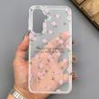 قاب گوشی Galaxy A16 سامسونگ شفاف پشت طلقی شیشه‌ای دور ژله ای طرح گل صورتی