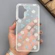 قاب گوشی Galaxy A17 سامسونگ شفاف پشت طلقی شیشه‌ای دور ژله ای طرح گل آبی