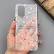 قاب گوشی Galaxy A32 4G سامسونگ شفاف پشت طلقی شیشه‌ای دور ژله ای طرح گل صورتی