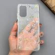قاب گوشی Galaxy A32 4G سامسونگ شفاف پشت طلقی شیشه‌ای دور ژله ای طرح گل