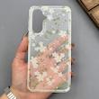 قاب گوشی Galaxy A37 سامسونگ شفاف پشت طلقی شیشه‌ای دور ژله ای طرح گل سفید