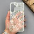 قاب گوشی Galaxy A54 سامسونگ شفاف پشت طلقی شیشه‌ای دور ژله ای طرح گل سفید 