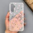 قاب گوشی Galaxy A54 سامسونگ شفاف پشت طلقی شیشه‌ای دور ژله ای طرح گل صورتی