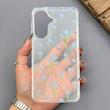 قاب گوشی Galaxy A57 سامسونگ شفاف پشت طلقی شیشه‌ای دور ژله ای طرح گل آبی 