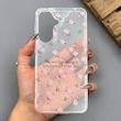 قاب گوشی Galaxy A57 سامسونگ شفاف پشت طلقی شیشه‌ای دور ژله ای طرح گل صورتی