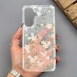 قاب گوشی Galaxy A57 سامسونگ شفاف پشت طلقی شیشه‌ای دور ژله ای طرح گل سفید