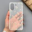 قاب گوشی Redmi 13C - Poco C65 شیائومی شفاف پشت طلقی شیشه‌ای دور ژله ای طرح گل لاله 