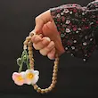 تسبیح با آویز گل گلدوزی شده