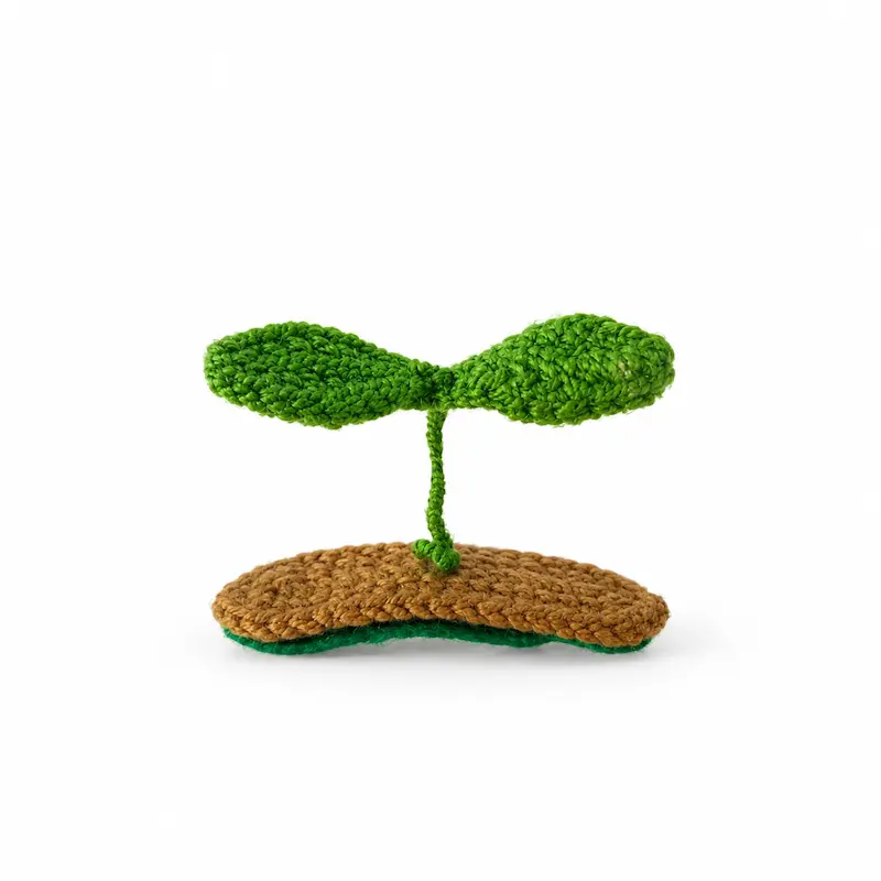گیره مو بافتنی طرح جوانه دوبرگ سبز روی پایه قهوه‌ای روشن