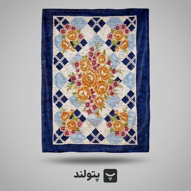 پتو یکنفره گلدار سرمه‌ای با طرح گل نارنجی از برند گلبافت، موجود در پتولند نمایندگی رسمی بازار تهران؛ شیک، چشم‌نواز و مناسب برای دکوراسیون مدرن و گرم.