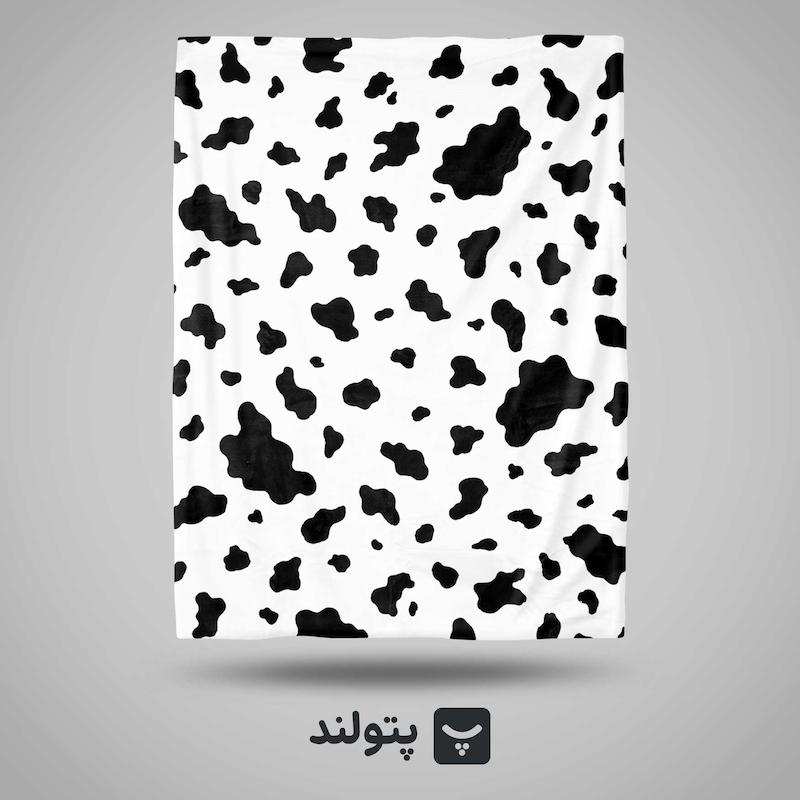 پتو یکنفره طرح پوست گاوی سفید از برند گلبافت، موجود در پتولند نمایندگی رسمی بازار تهران؛ خاص، مدرن و مناسب برای دکوراسیون متفاوت و شیک.