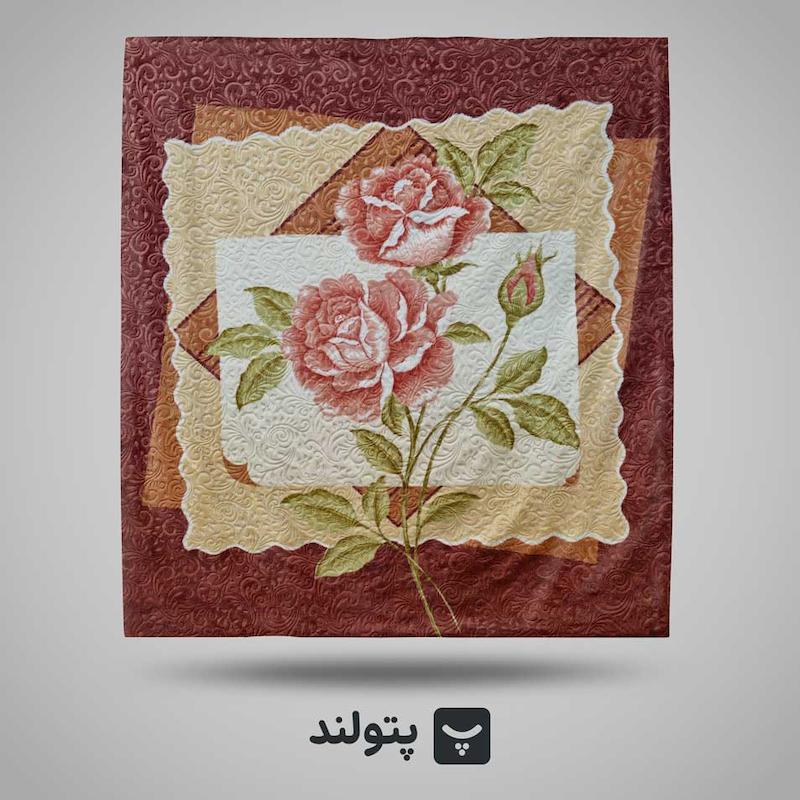 پتو گلبافت دونفره گلدار برجسته با زمینه قهوه ای و کرم و گل های صورتی  و با ساقه سبز رنگ و با کادری ساده.