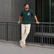 تیشرت مردانه باکسی نخ پنبه طرح گرافیکی گل پرسیسکا