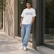 تیشرت مردانه باکسی نخ پنبه طرح گرافیکی ساحلی پرسیسکا