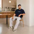 تیشرت مردانه باکسی نخ پنبه طرح گرافیکی آبمیوه پرسیسکا