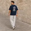 تیشرت مردانه باکسی نخ پنبه طرح گرافیکی آبمیوه پرسیسکا