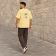 تیشرت مردانه باکسی نخ پنبه طرح گرافیکی آبمیوه پرسیسکا