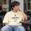 تیشرت مردانه باکسی دو نخ پنبه طرح عروسکی WOODER پرسیسکا