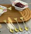 قاشق چای خوری طلایی طرح قلب نگین دار 