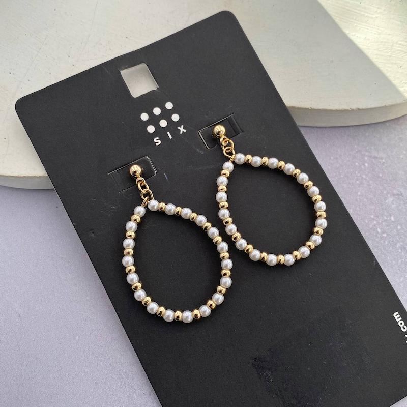 گوشواره مروارید و گوی طلایی