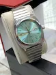 ساعت مچی مردانه تیسوت tissot | طراحی PRX | بند ریلی | روزشمار کد 1004