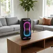 اسپیکر بلوتوثی قابل حمل جی بی ال مدل PartyBox 130، با توان خروجی 200 وات، 2 ووفر 5.25 اینچی و 2 توییتر 1 اینچی، Bluetooth 6، TWS و AuraCast، دارای 2 ورودی میکروفون، ورودی گیتار، نورپردازی RGB و ورودی AUX