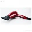 سشوار رمینگتون مدل AC9096 Silk قرمز رنگ با نازل متمرکز کننده از نمای پایین روی سطح سفید.