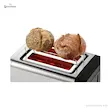 المنت‌های حرارتی سرخ شده و داغ توستر بوش مدل TAT5P425 در حال گرم کردن نان‌های گرد از نمای بالا.