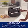 مرد در حال تنظیم برنامه پخت روی پنل دیجیتال سرخ کن بدون روغن نینجا مدل AF500 کنار نان تازه.