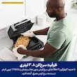 مردی در حال قرار دادن سبد سرخ کن حاوی سیب زمینی خلال شده داخل محفظه گریل نینجا مدل DG551