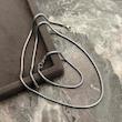 نمای بالا ست گردنبند و دستبند ماری لوله ای نقره ای 