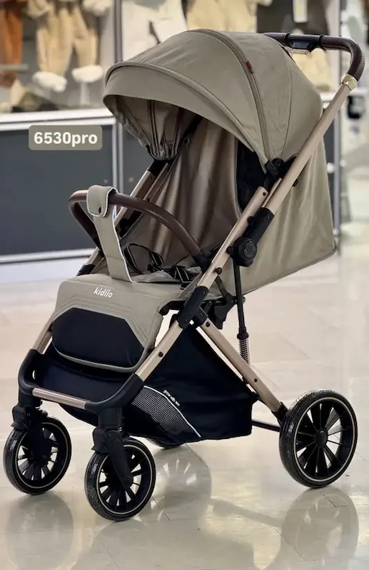 کالسکه مسافرتی کیدیلو مدل kidilo 6530 pro رنگ کرم 