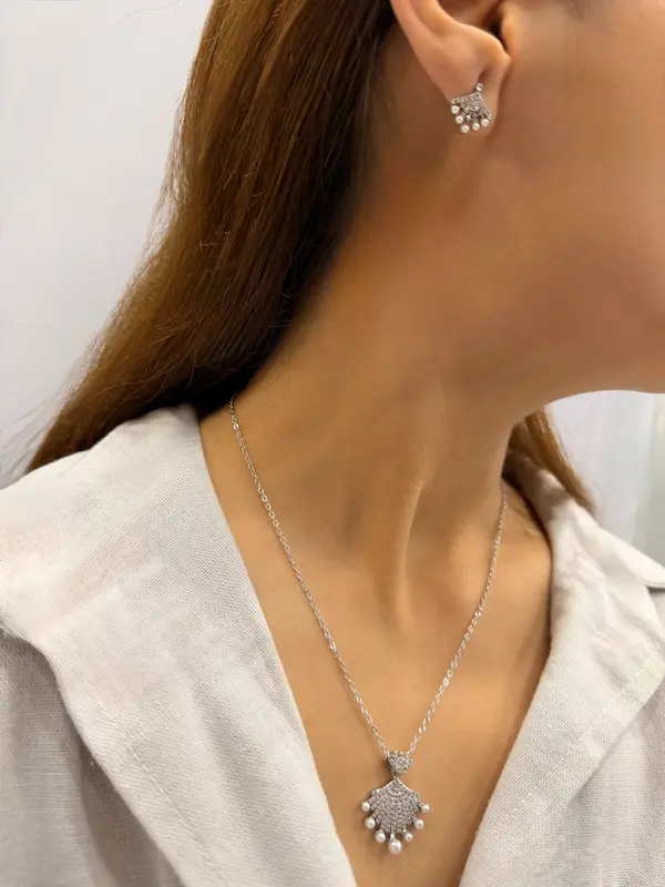 نیم ست گردنبند و گوشواره نقره ای استیل پر طاووس کد GA00087