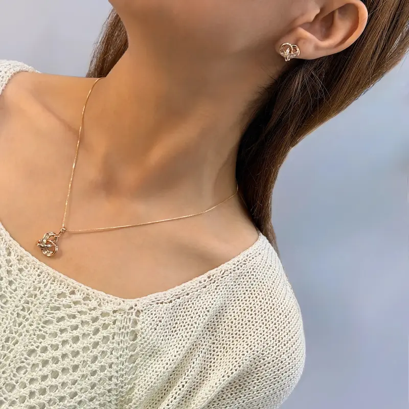 نیم ست گردنبندگوشواره ژوپینگ گره الماسه کد GA00143